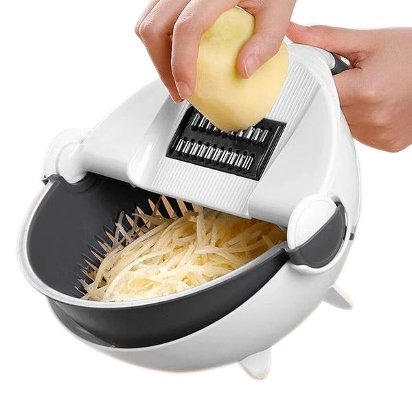 Vegetable cutter with attached rotating drain basket and slicing blades