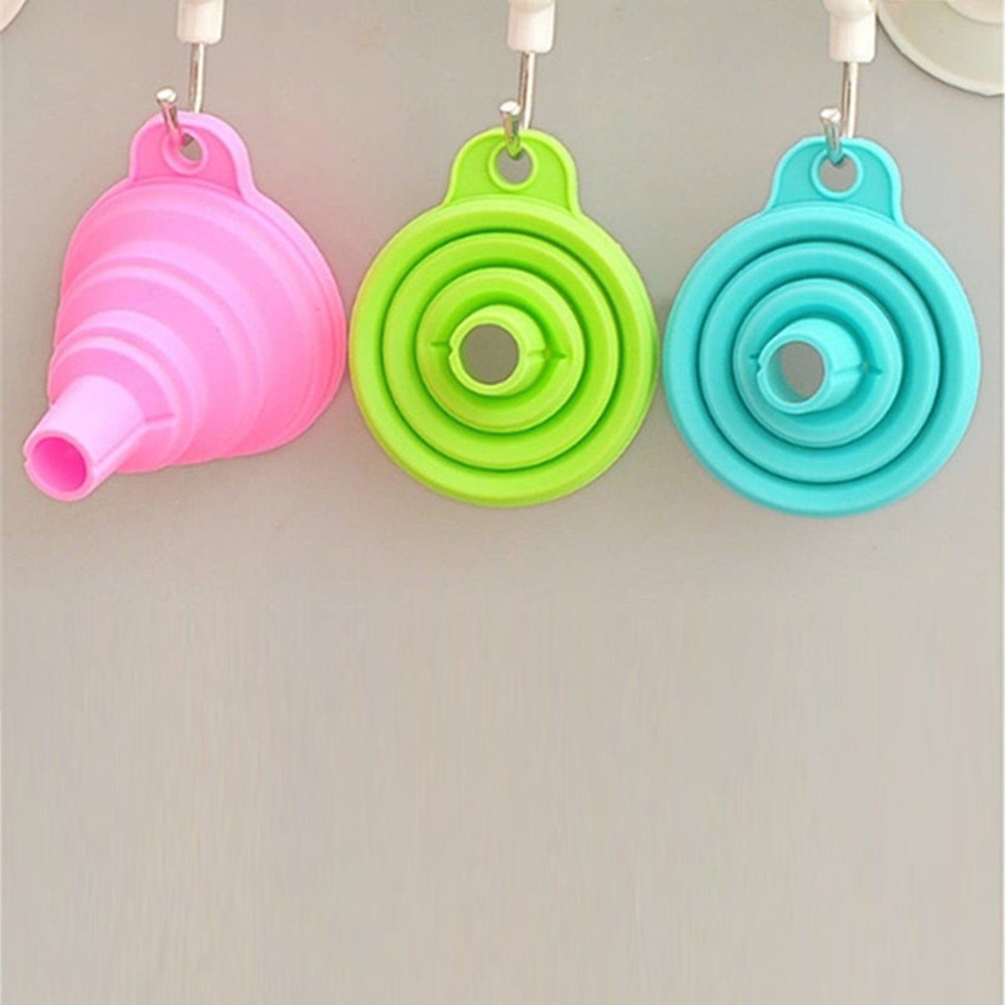 Foldable silicone funnel for kitchen use.